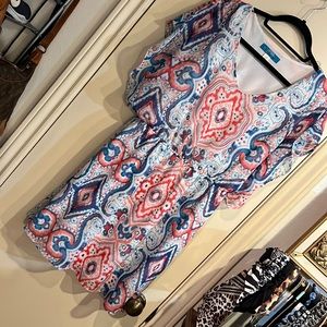 Dress in colorful print on white background. Lined. Size large